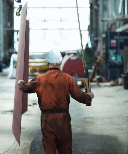 industrial worker using a wrench. workplace with chemicals.
